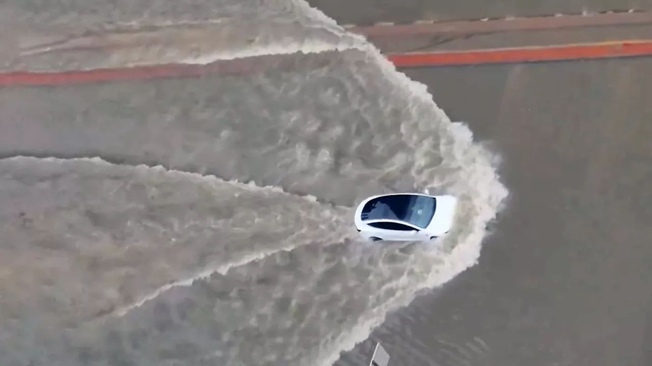 Watch A Tesla Model 3 And Porsche Taycan Drive Down Flooded Streets In Dubai