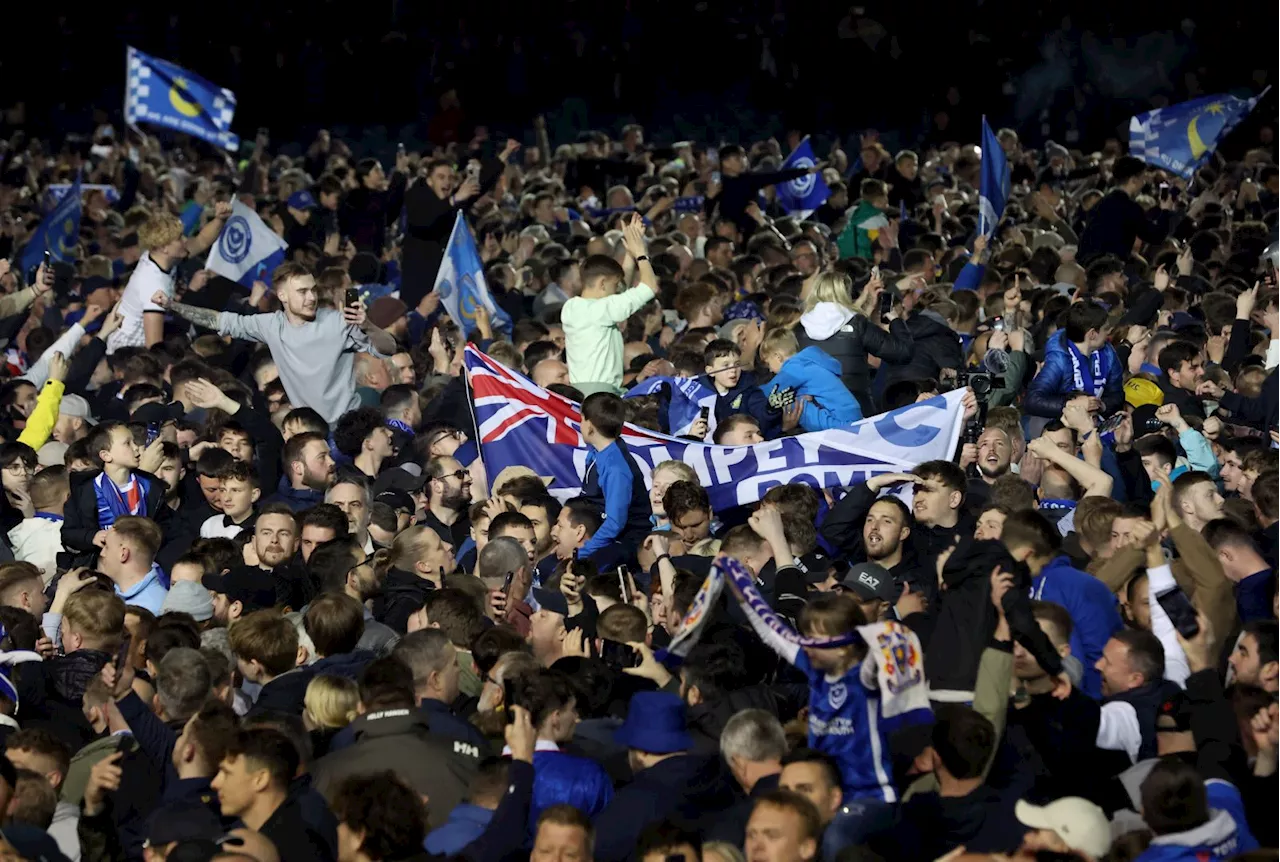 Fans storm pitch at Fratton Park as Portsmouth secure League One title