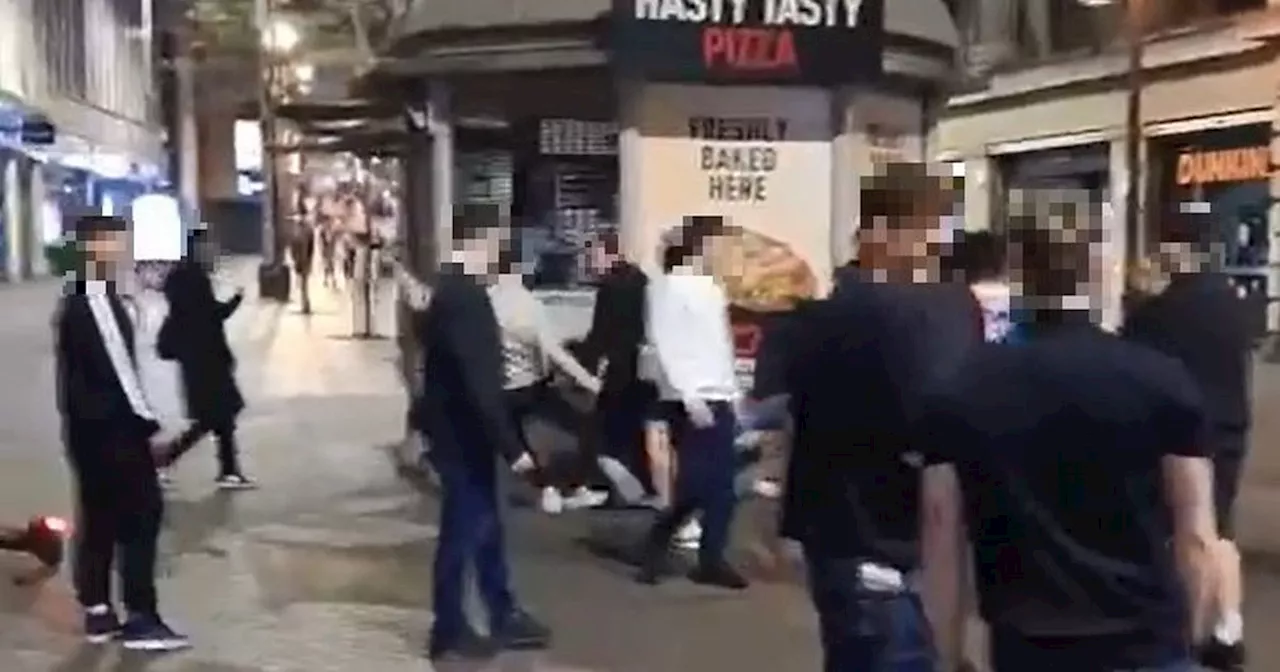 Footage shows brawl between two groups after row breaks out inside pub