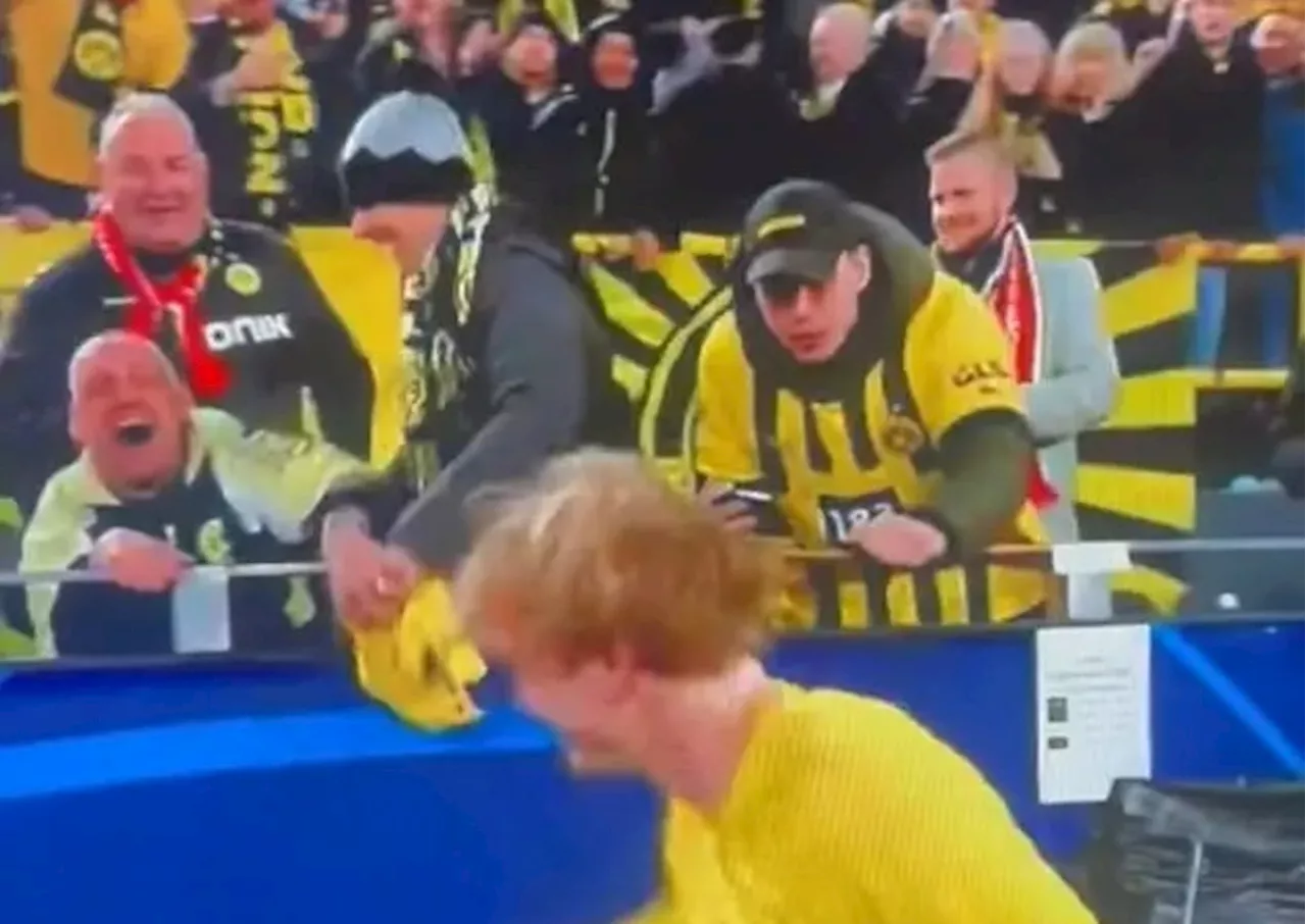 Borussia Dortmund star responds to video of fan appearing to steal shirt from supporter in wheelchair...