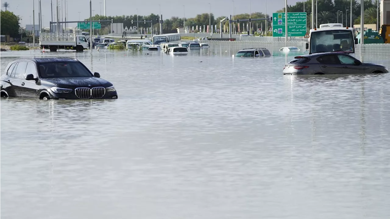 A storm dumps record rain across the desert nation of UAE and floods the Dubai airport