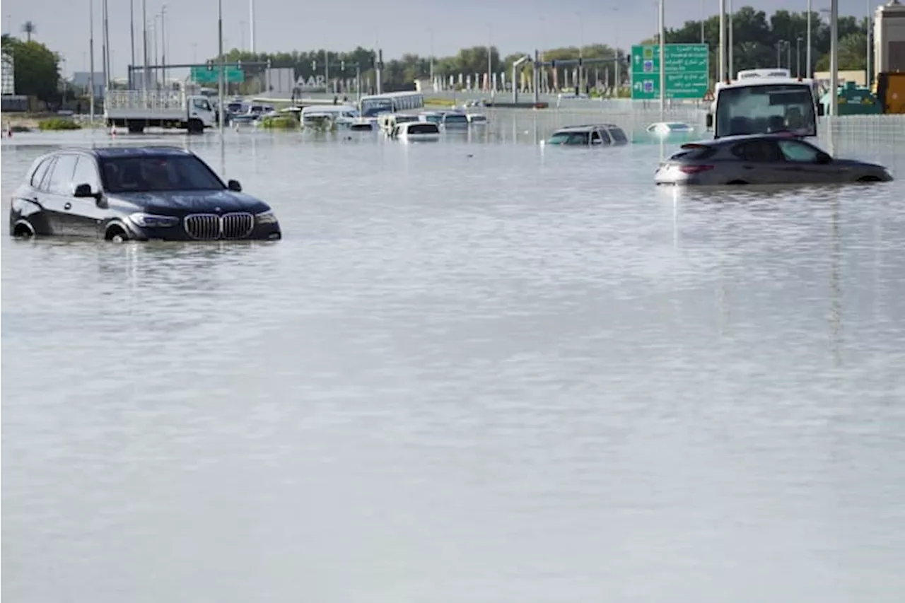 A storm dumps record rain across the desert nation of UAE and floods the Dubai airport