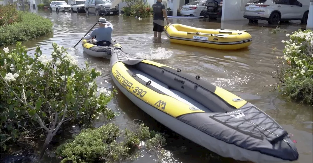 Dubai residents kayak through desert streets after freak rainfall