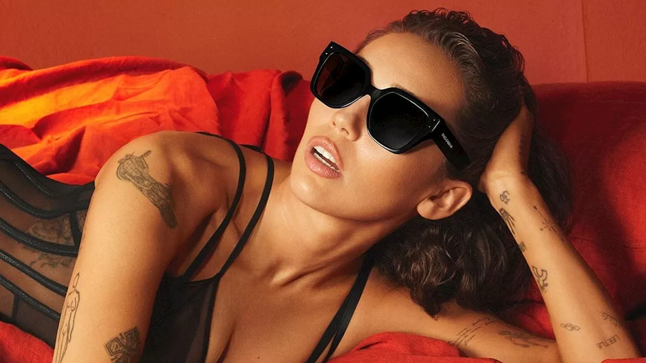 Miley Cyrus goes to bed in her sunglasses and sexy black lingerie in new images from Dolce & Gabbana...