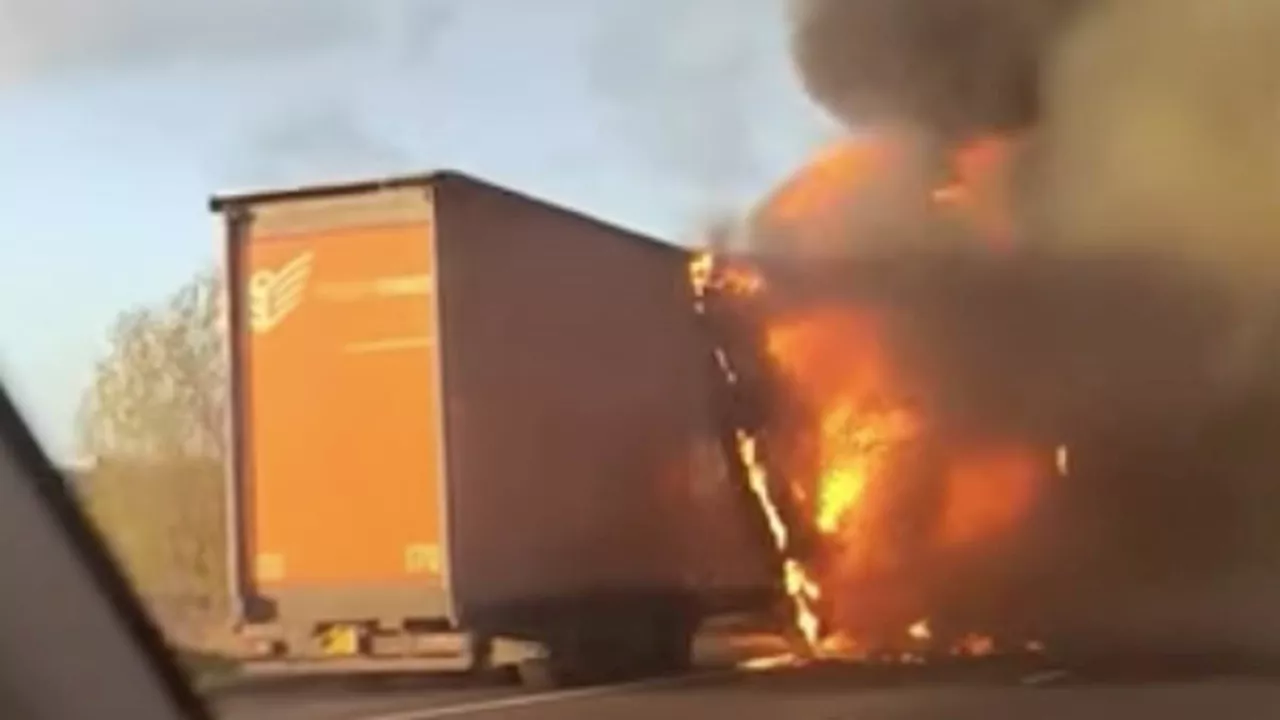Dramatic moment lorry on the M56 is engulfed by flames
