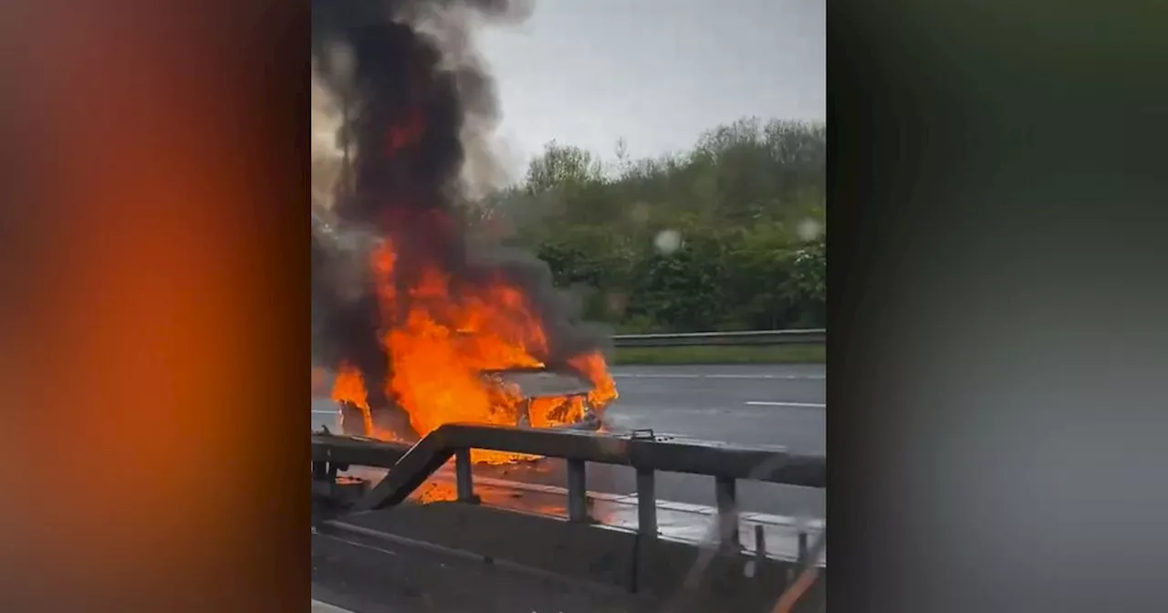 M60 traffic LIVE: Traffic stopped near Stockport as vehicle seen in flames amid 'four mile' queues