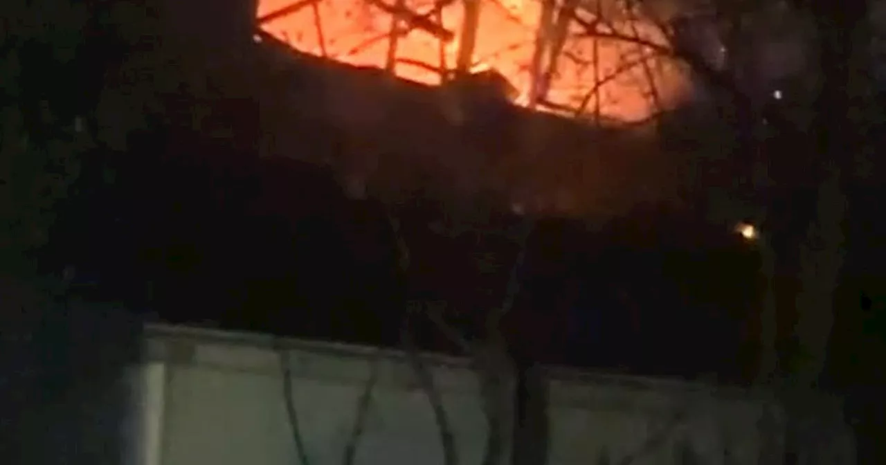 Dramatic moment Glasgow building roof caves in as terrified local captures fire on video