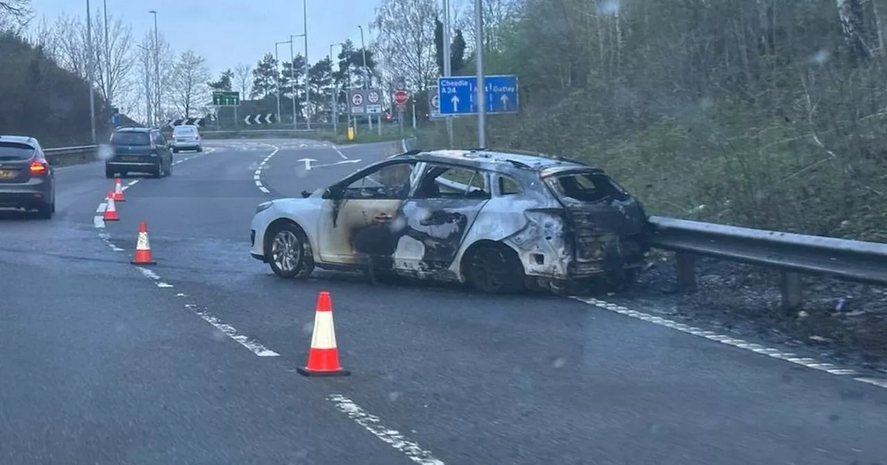 Burnt out car causes delays on M60