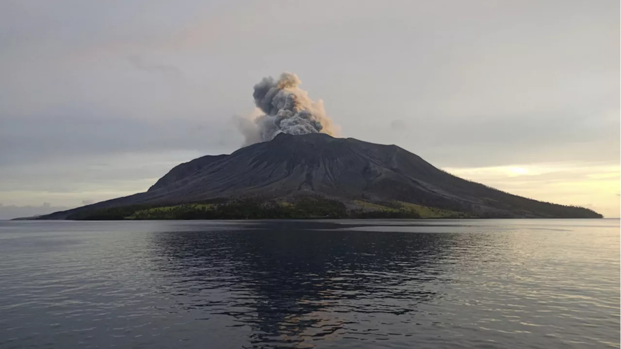 More than 2,100 people are evacuated as an Indonesian volcano spews clouds of ash