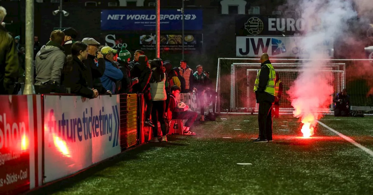 Crazy scenes as kid runs on pitch with flare as Rovers fans pelted with objects