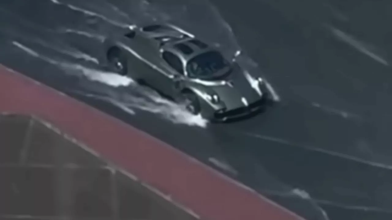 Watch moment incredibly rare £2million hypercar ploughs through Dubai floods with roads completely...