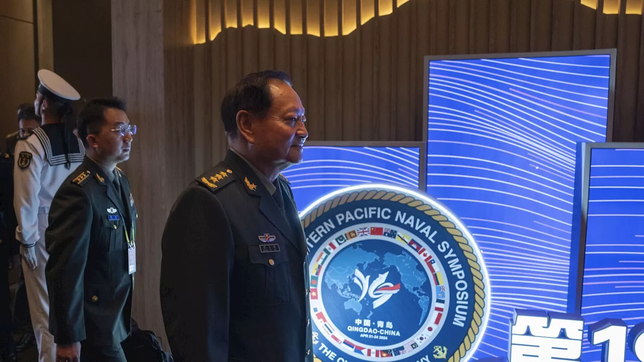 Chinese general takes a harsh line on Taiwan and other disputes at an international naval gathering