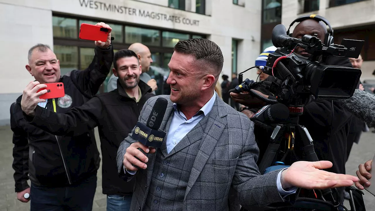 Tommy Robinson broadcasts for his 'Urban Scoop' platform as he arrives at court for refusing to...