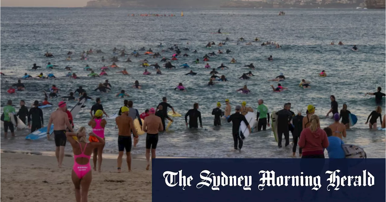 Hundreds of surfers paddle out for moving tribute to Bondi Junction victims