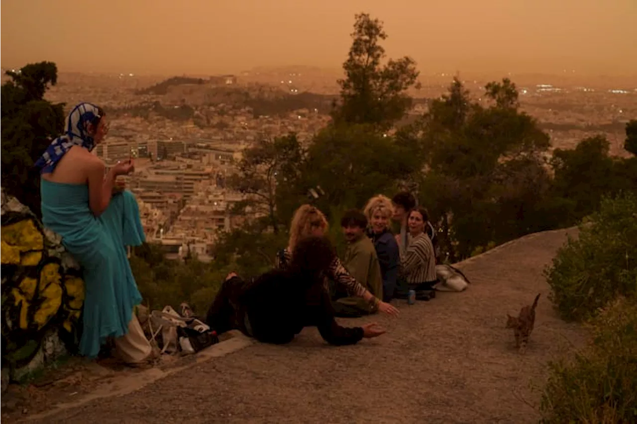 Martian skies over Athens? Greece's capital turns an orange hue with dust clouds from North Africa