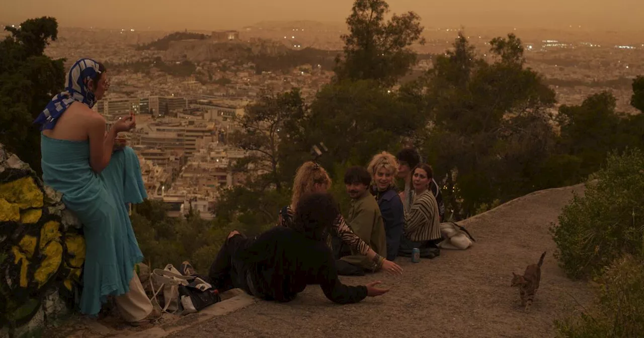 Martian skies over Athens? Greece's capital turns an orange hue with dust clouds from North Africa