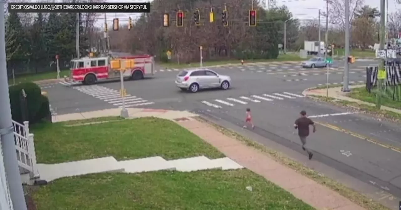 Dramatic video shows Connecticut girl saved at last moment from running into traffic