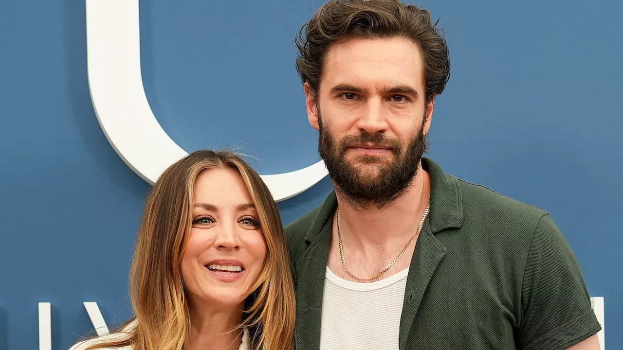 Kaley Cuoco poses up with her steamy Based On A True Story leading man Tom Bateman at...