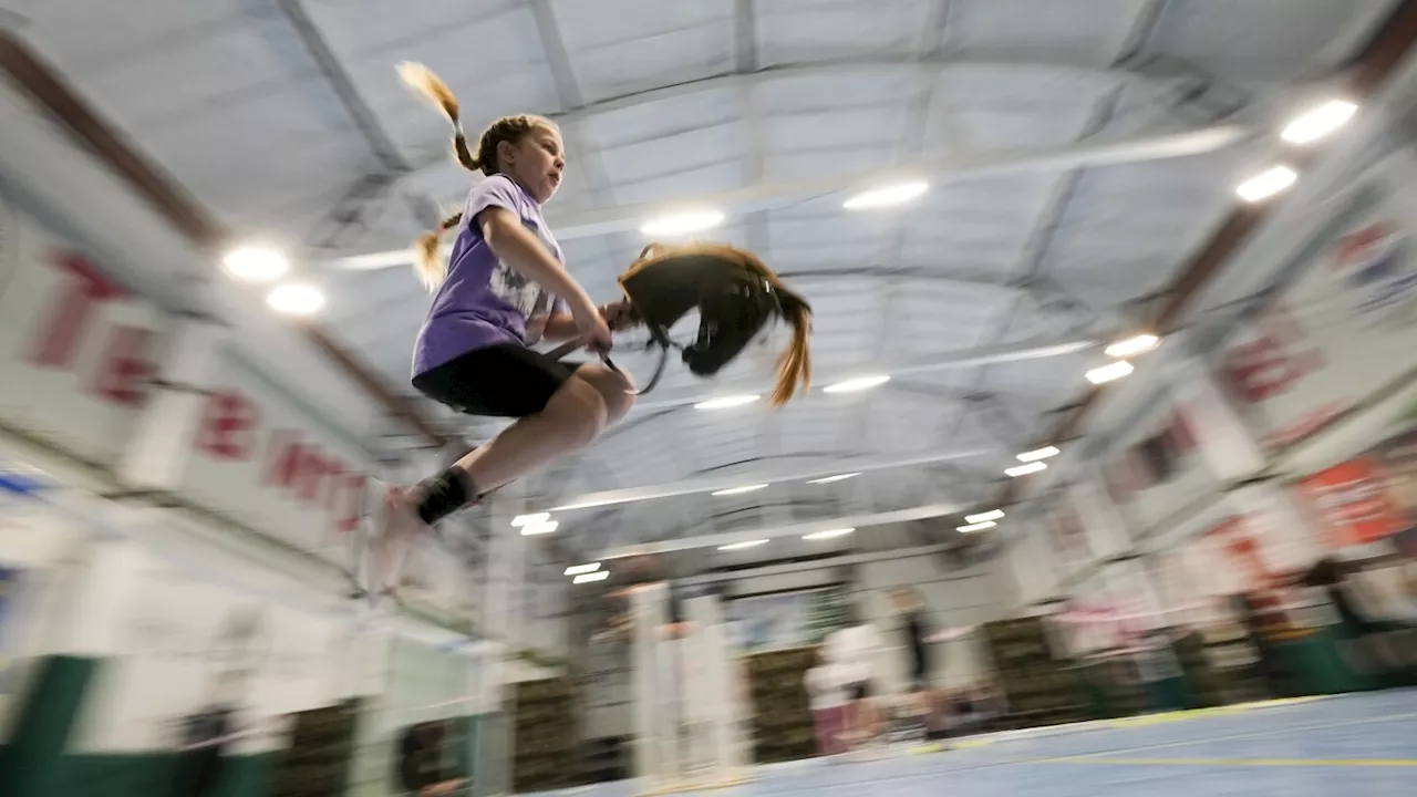 AP PHOTOS: Russian kids ride sticks with a horse's head in hobby horsing competition