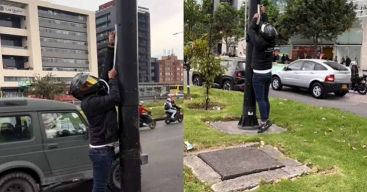 Aplauden en redes a hombre que señala cámaras de fotomultas con cinta reflectiva en Bogotá