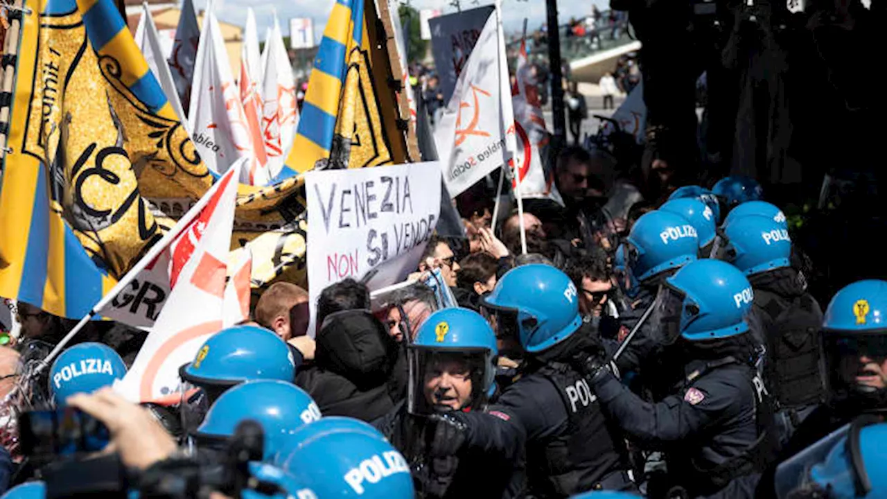 Venice residents clash with riot police as city launches world’s first tourist entry fee