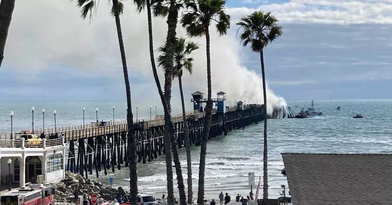 Firefighters battling large blaze on end of Oceanside pier