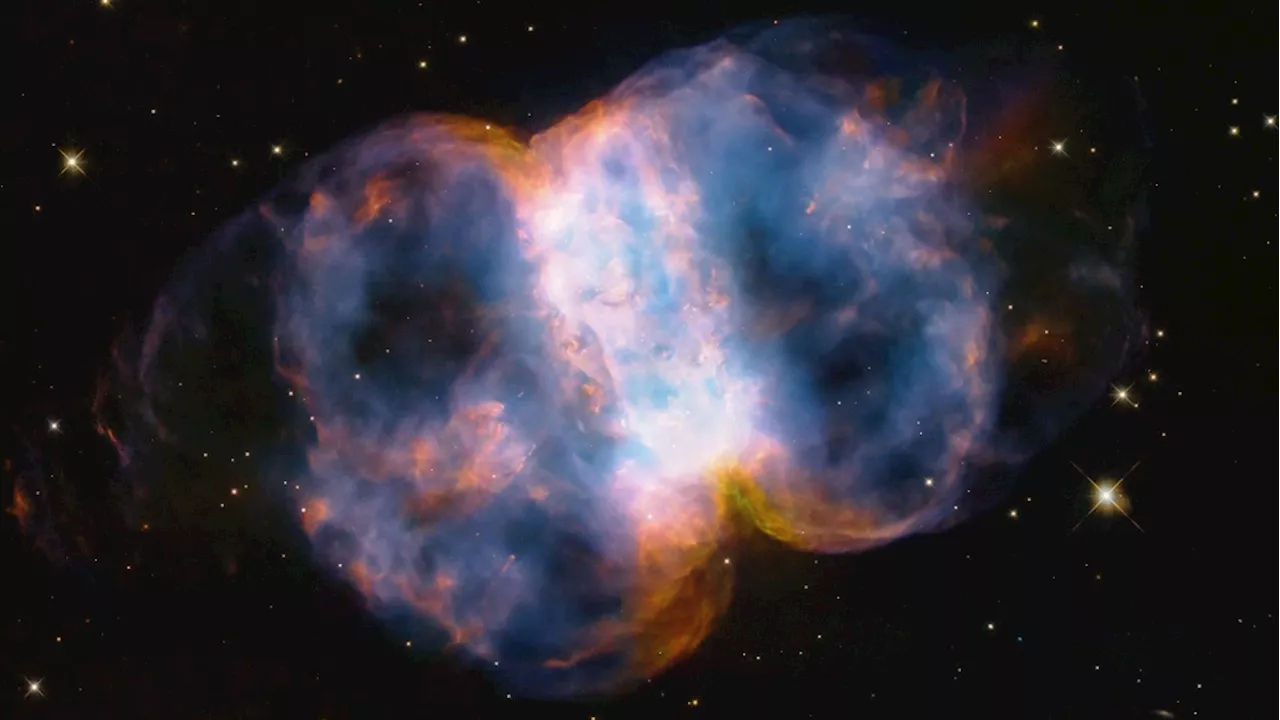 Hubble Space Telescope marks 34 years with new portrait of a 'cosmic dumbbell'