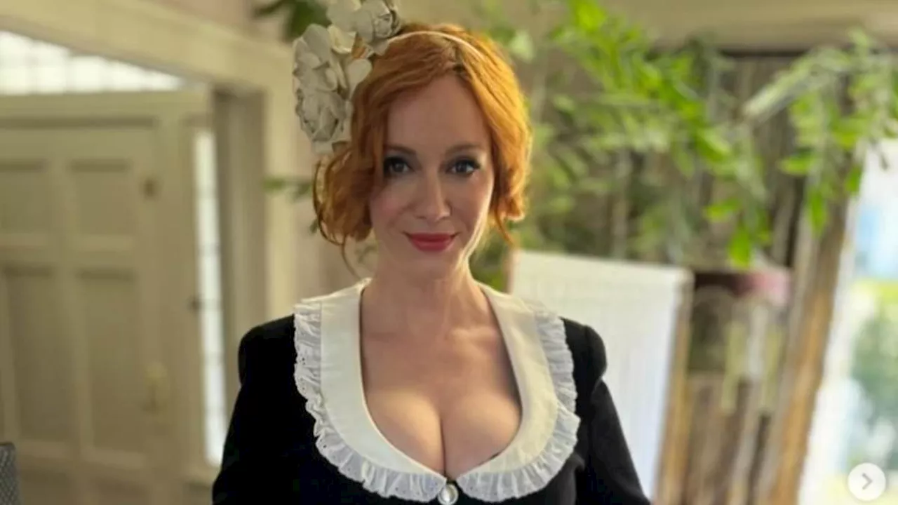 Christina Hendricks puts on a busty display in a milkmaid dress as she poses with Shirley Manson at...