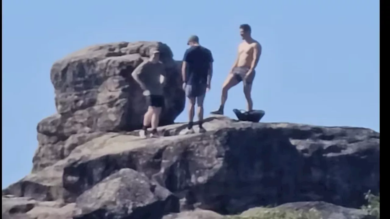 Why this photograph of three men standing in the Australian bush has bitterly divided a community:...