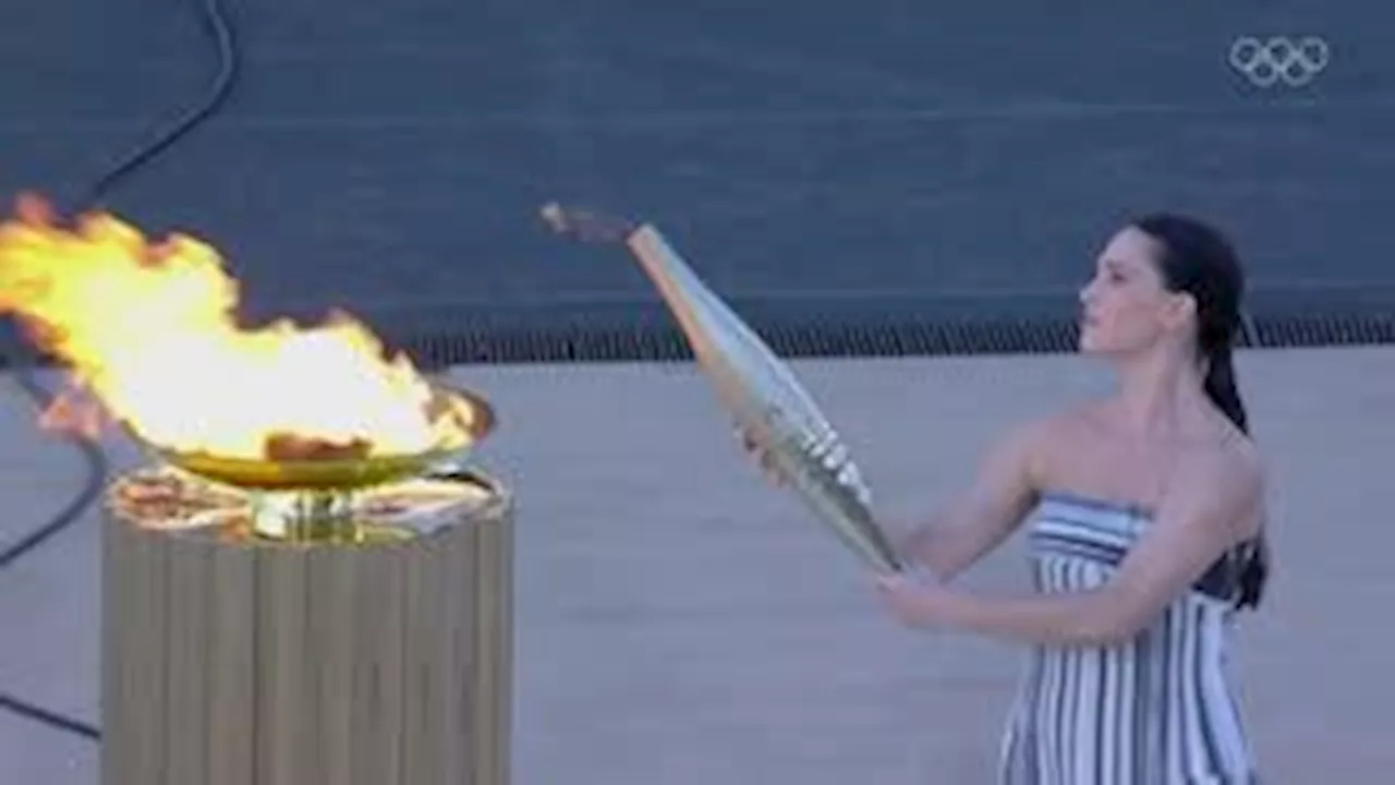 Greece hands over Olympic flame to Paris 2024 organisers during ceremony in Athens