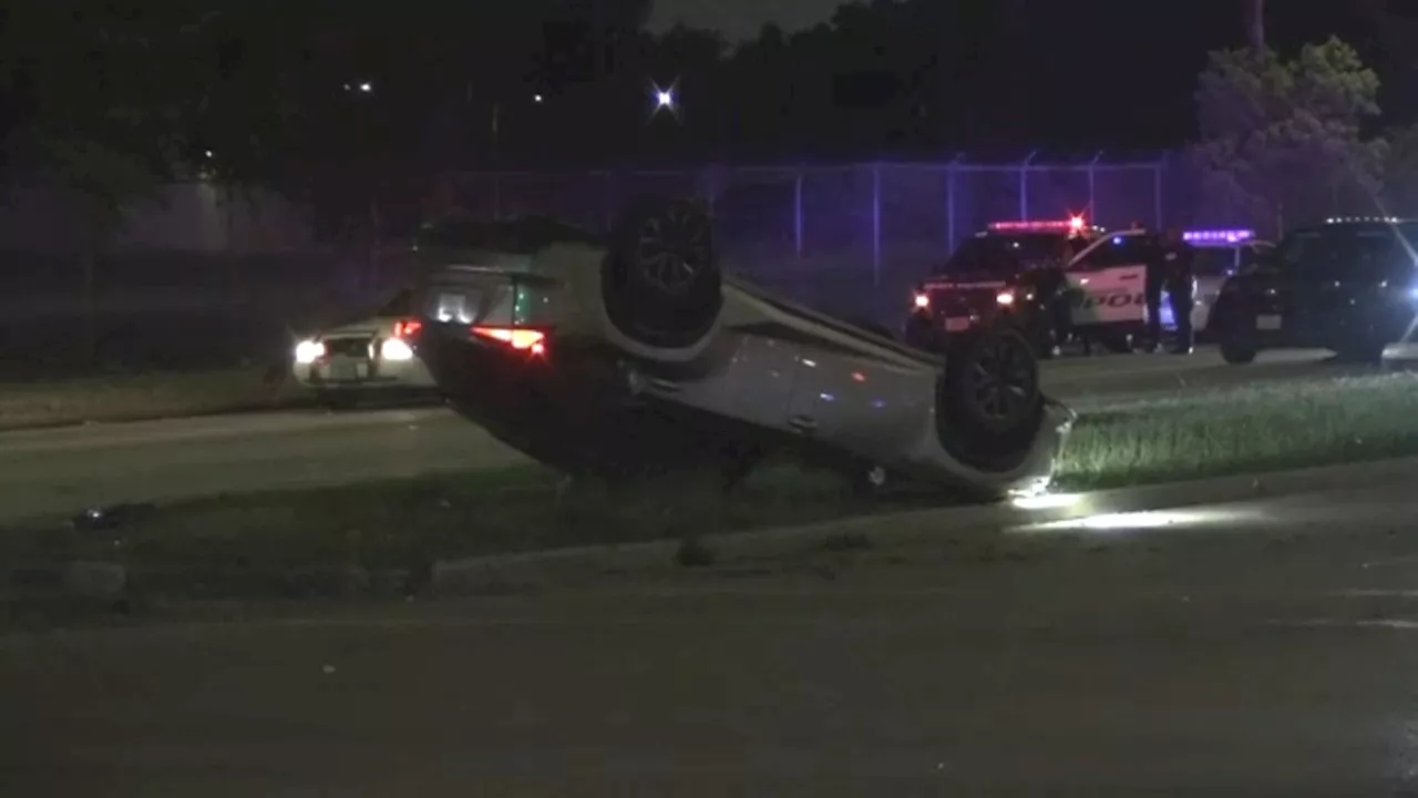 Driver rolls over in crash after colliding with officer who was responding to robbery, HPD says