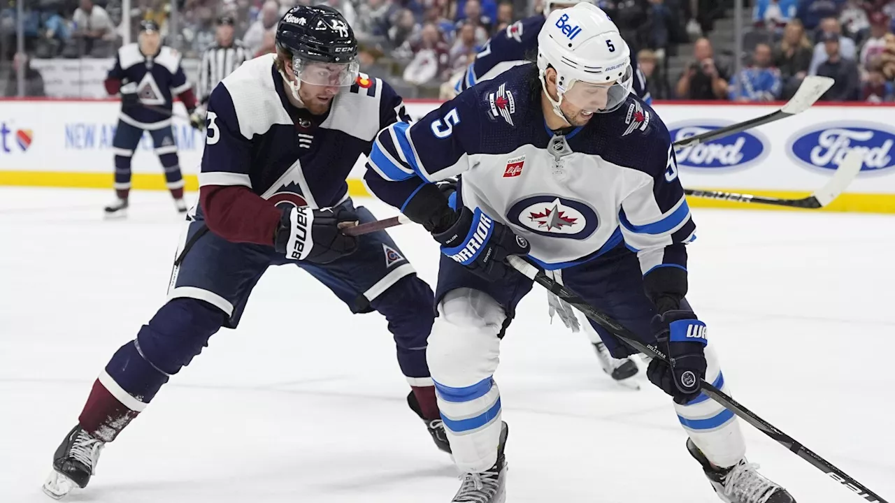 Jets defenseman Brenden Dillon heads to locker room with hand bleeding after fight following game