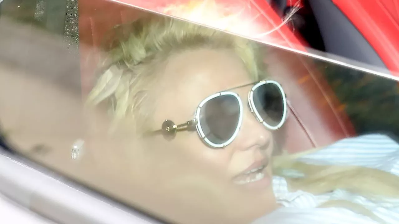 Britney Spears CRACKS windshield of Mercedes G-Wagen while crouched in passenger seat before...