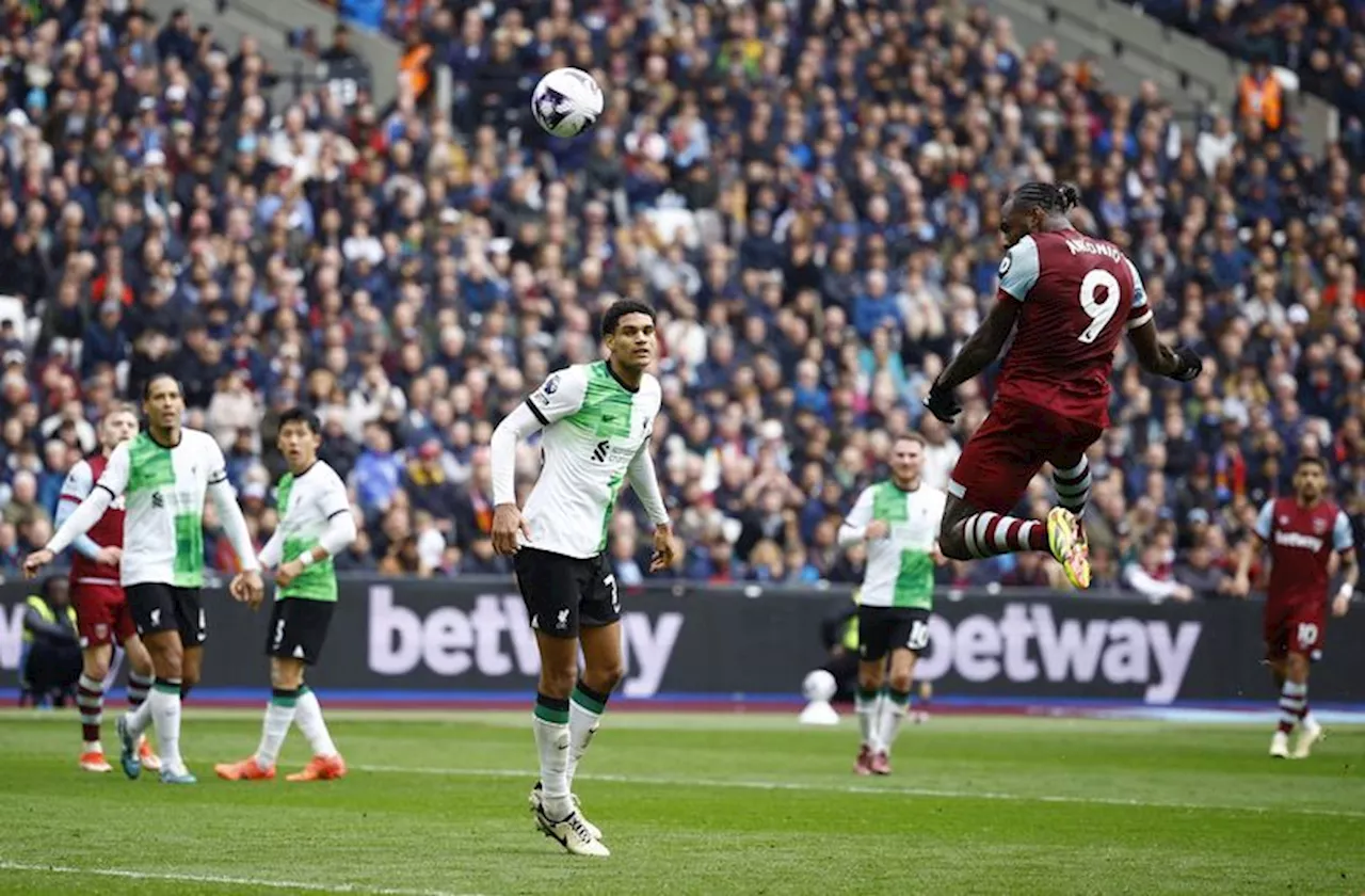 Soccer-Liverpool's slim title hopes fade further with 2-2 draw at West Ham