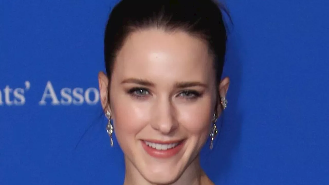 Rachel Brosnahan is a radiant beauty in a chic black sleeveless gown as she hits the red carpet...