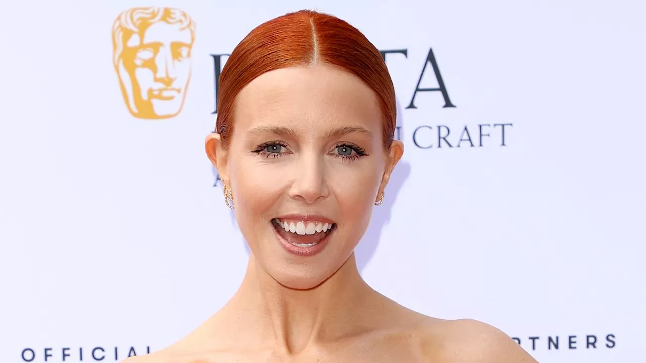 Stacey Dooley puts on a leggy display in a sexy red dress as she joins stylish Katie Piper at the...