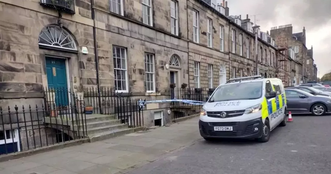 BMW convertible crashes through railings on plush Edinburgh street