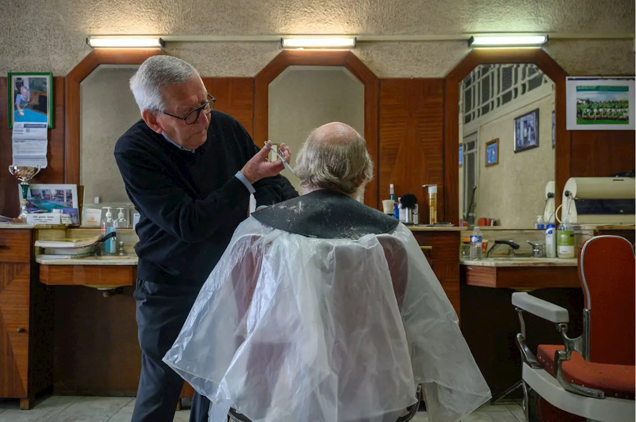 Outliving greased back quiffs and bowl cuts: French barber still trimming at 90