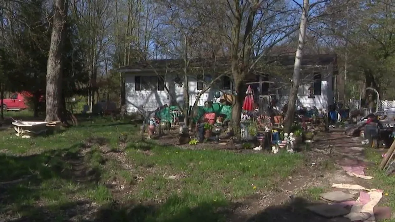 Neighbors confront mounting trash issue as alleged squatters move into Central Ohio home