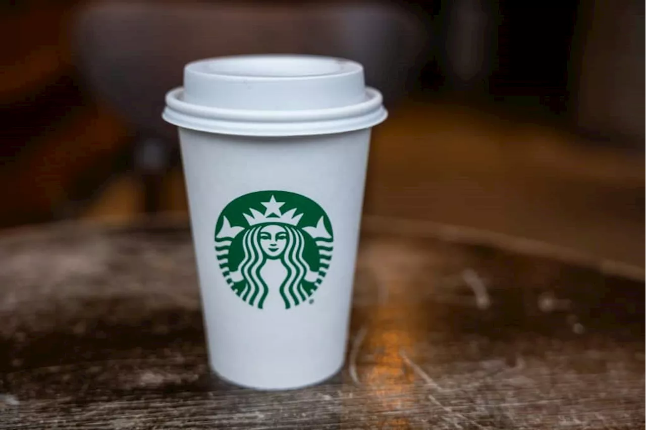 Starbucks points to weaker consumer as profit falls