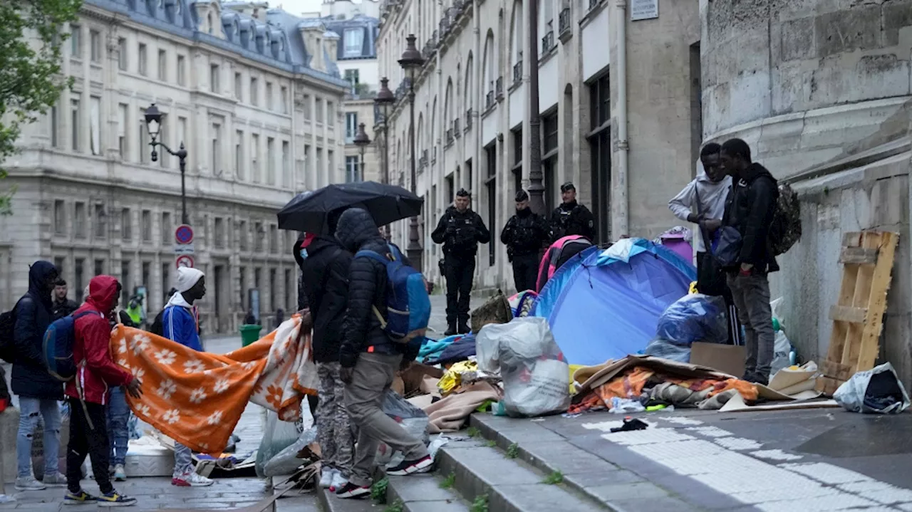 Ahead of the Paris Olympics, police clear a migrant camp near City Hall