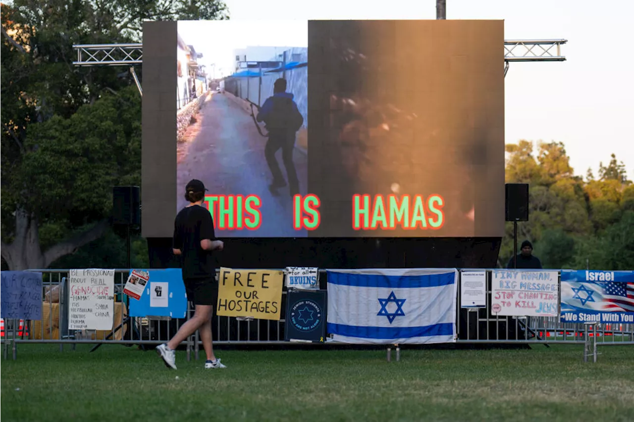 Screens Playing Loop of Hamas Oct. 7 Attacks Erected Facing Campus Protests