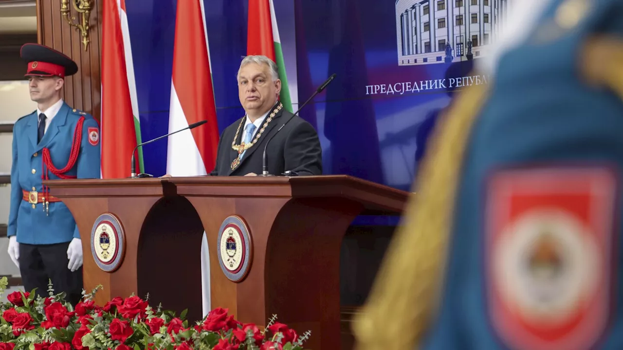 Hungary's Prime Minister Viktor Orban receives a medal from pro-Russia Bosnian Serb president Dodik