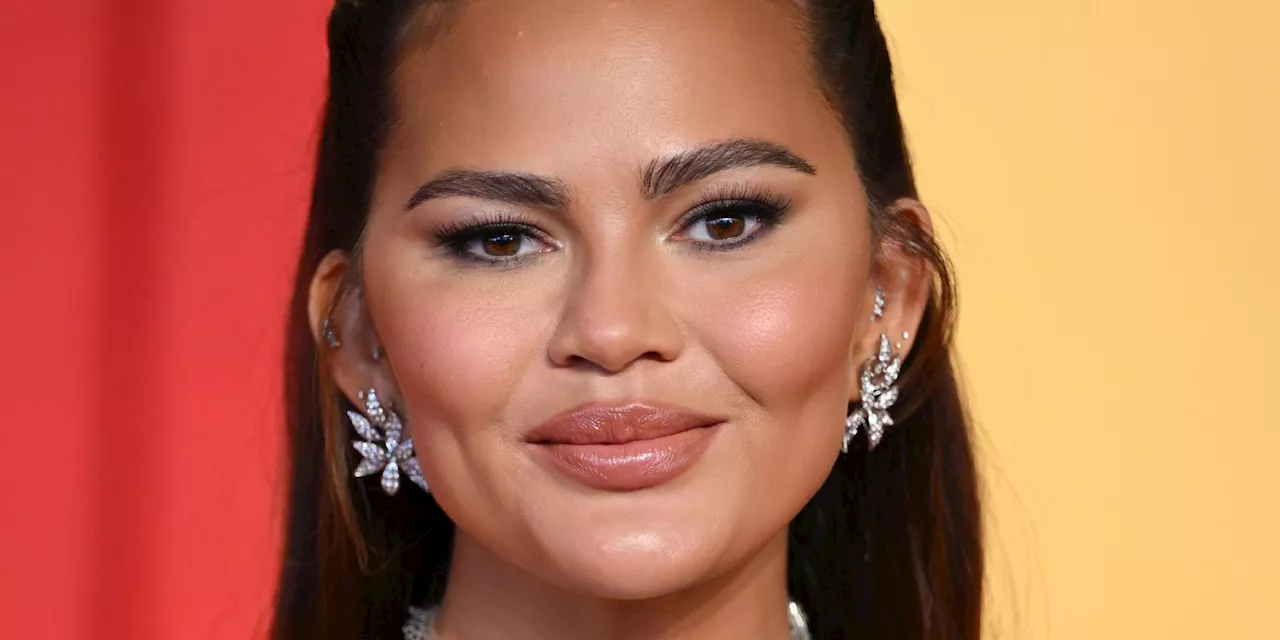 Chrissy Teigen Wore a Tiny Tasseled Black Bikini in Thailand