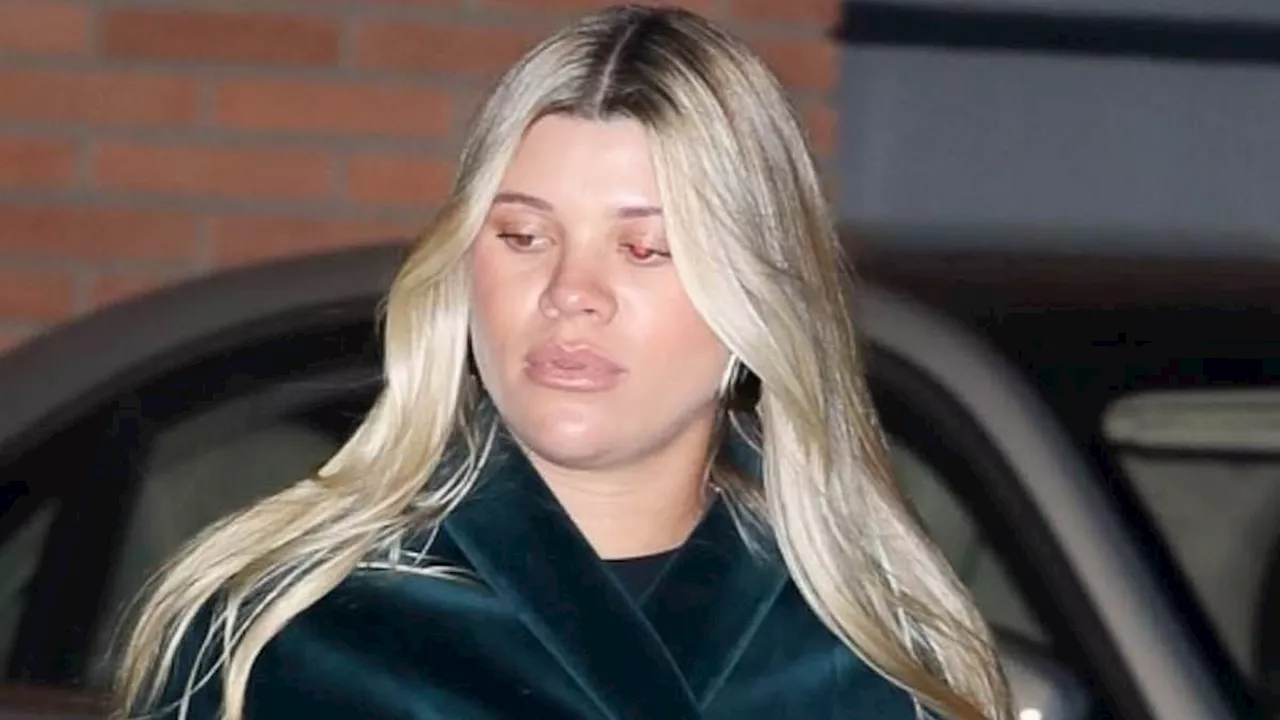 Sofia Richie covers up her growing baby bump with a chic velvet robe while leaving Beverly Hills...