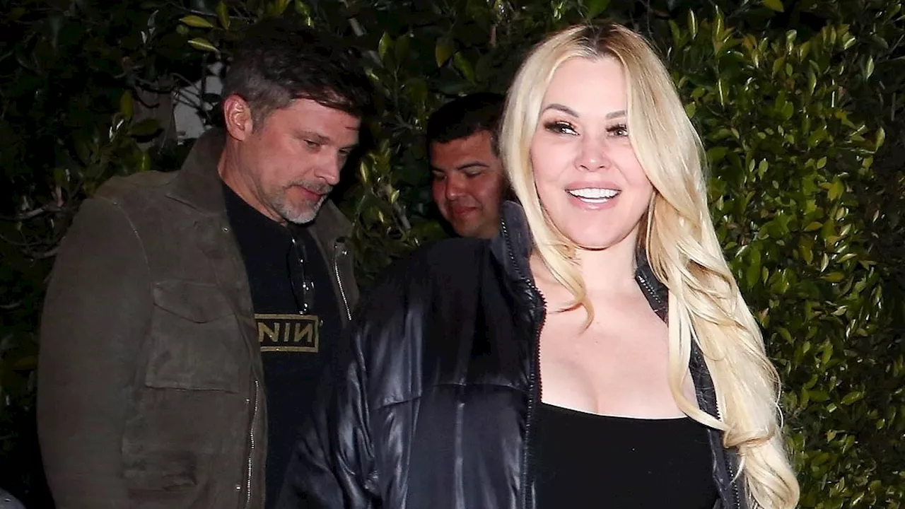 Travis Barker's ex-wife Shanna Moakler is seen getting cozy with Greg Vaughn at an album release...