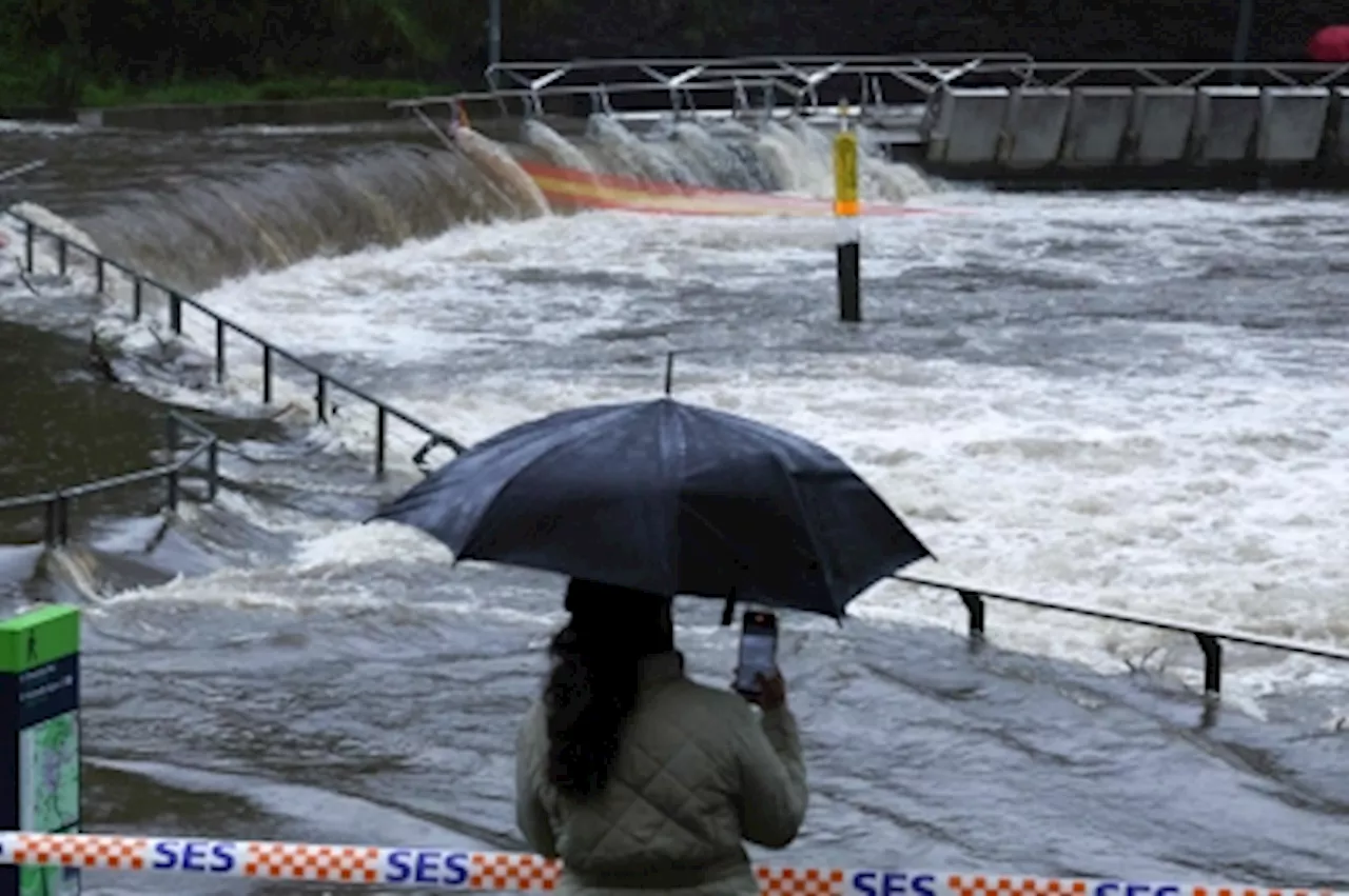 Flood-hit Sydney residents urged to higher ground after torrential rains