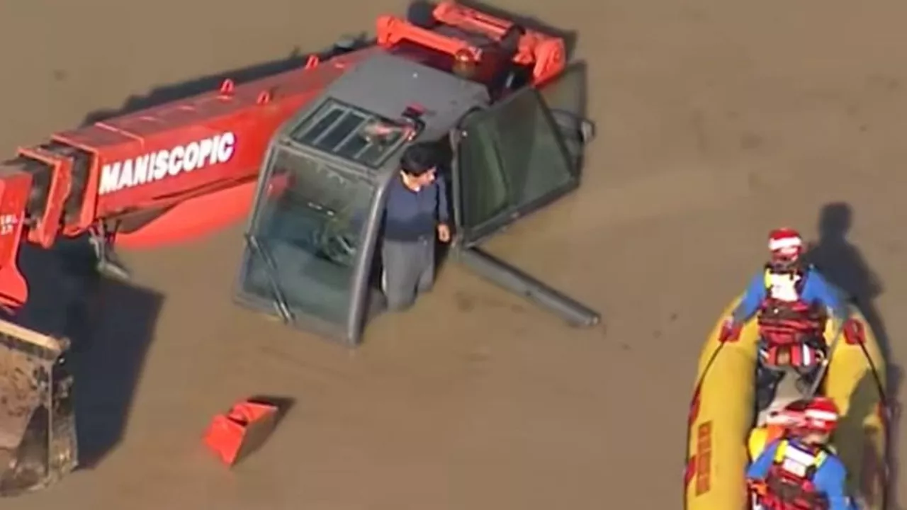 Dramatic Rescue: Man Saved from Submerged Excavator in Sydney Floodwaters