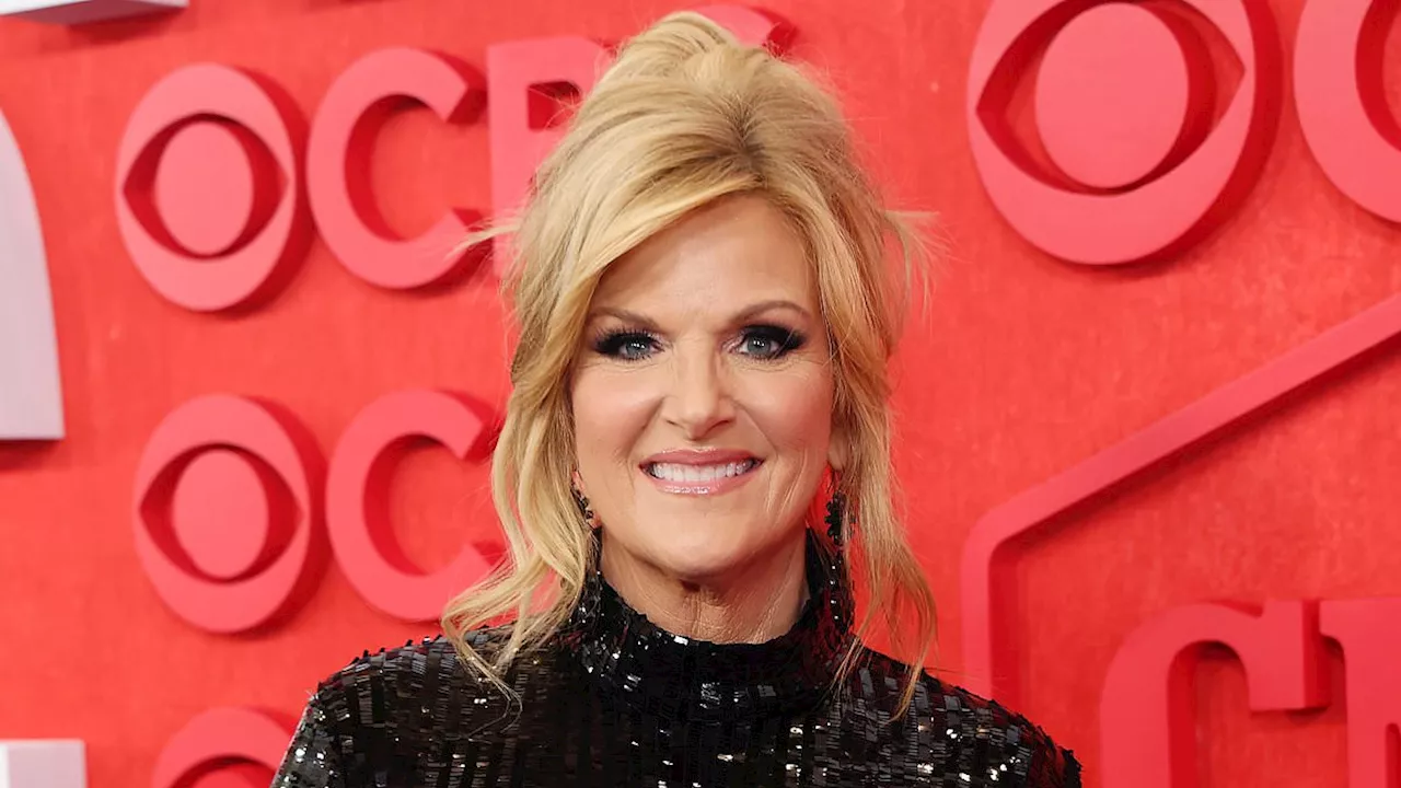 CMT Music Awards 2024: Trisha Yearwood, 59, shines in black dress with feathered sleeves before...