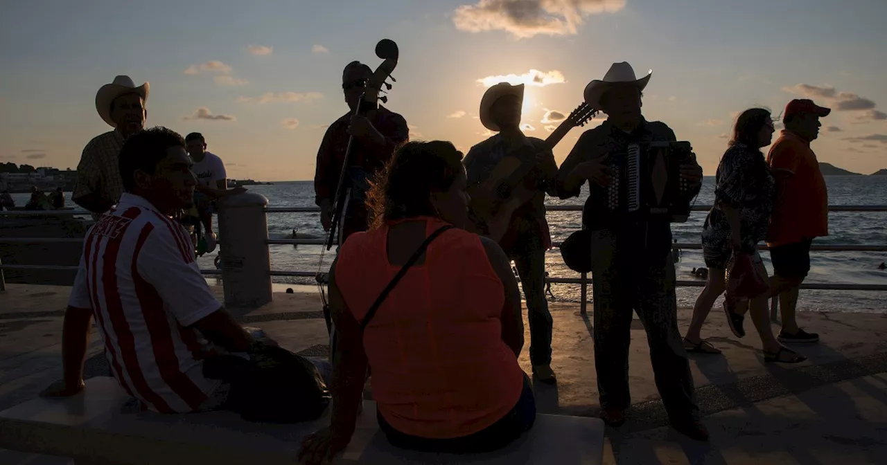 As total eclipse nears Mazatlán, banda groups stand their ground amid noise complaints